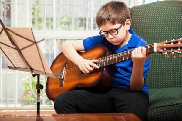 depositphotos_67248331-stock-photo-kid-practicing-some-guitar-chords.jpg