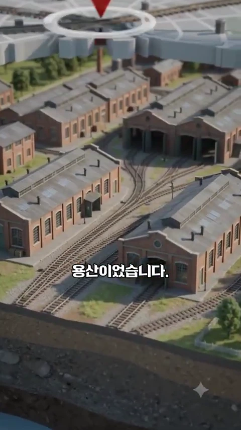 과거 기차 정비창의 모습을 재현한 3D 그래픽으로, 붉은 벽돌 건물들과 여러 갈래의 철로가 복잡하게 연결된 철도 정비 기지 전경.