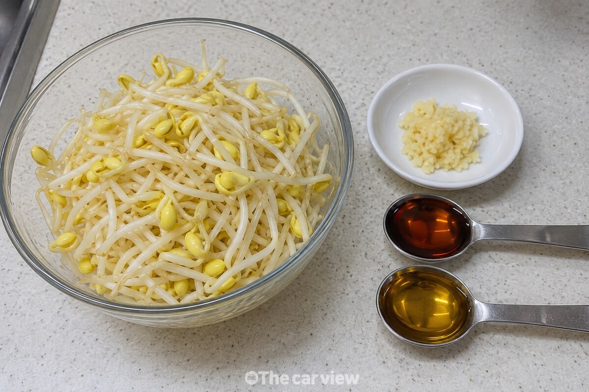 손질한 콩나물과 참치액, 참기름, 다진 마늘을 조리대에 필요한 만큼 놓은 모습. / 기사 이해를 돕기 위한 생성형 이미지
