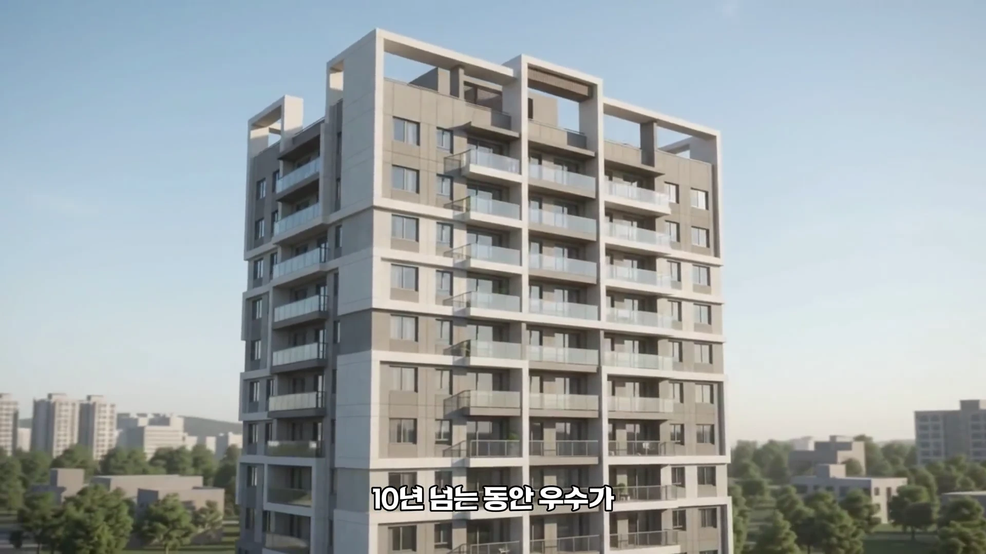 현대적인 디자인의 고층 아파트 단지가 맑은 하늘 아래 서 있는 모습입니다.