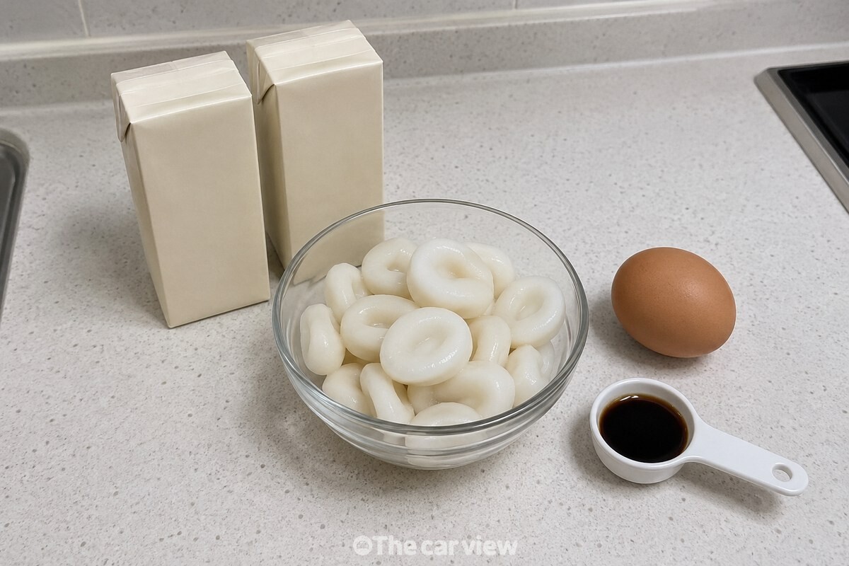 무가당 두유와 조랭이떡, 달걀, 국간장을 조리 전 깨끗한 조리대에 준비한 모습. / 기사 이해를 돕기 위한 생성형 이미지